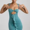 Vestido corto de jersey elástico con aberturas y volantes de Zivanka en verde mar Vestido corto de jersey elástico con aberturas y volantes de Zivanka en verde mar
