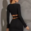 Vestido corto de manga larga con aberturas Enya en negro Vestido corto de manga larga con aberturas Enya en negro