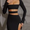 Vestido corto de manga larga con aberturas Enya en negro Vestido corto de manga larga con aberturas Enya en negro