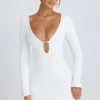 Vestido corto de manga larga con aberturas Mavisa en blanco