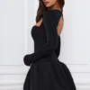 Vestido corto de manga larga con bajo abullonado Viola en negro Vestido corto de manga larga con bajo abullonado Viola en negro