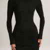 Vestido corto de manga larga con cuello barco y drapeado de modal Eska en negro Vestido corto de manga larga con cuello barco y drapeado de modal Eska en negro