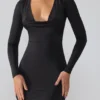 Vestido corto de manga larga con escote pronunciado de jersey elástico Oakley en negro