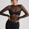 Vestido corto de manga larga con paneles transparentes Essie en negro