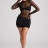 Vestido corto de manga larga con paneles transparentes Essie en negro