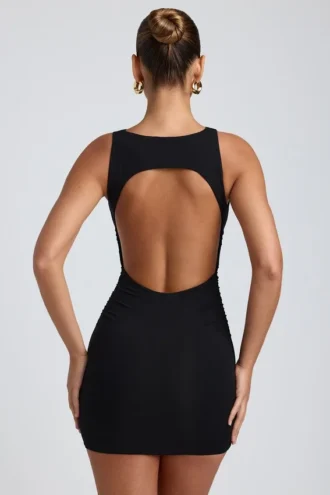 Vestido corto de modal, cuello alto y espalda abierta en negro