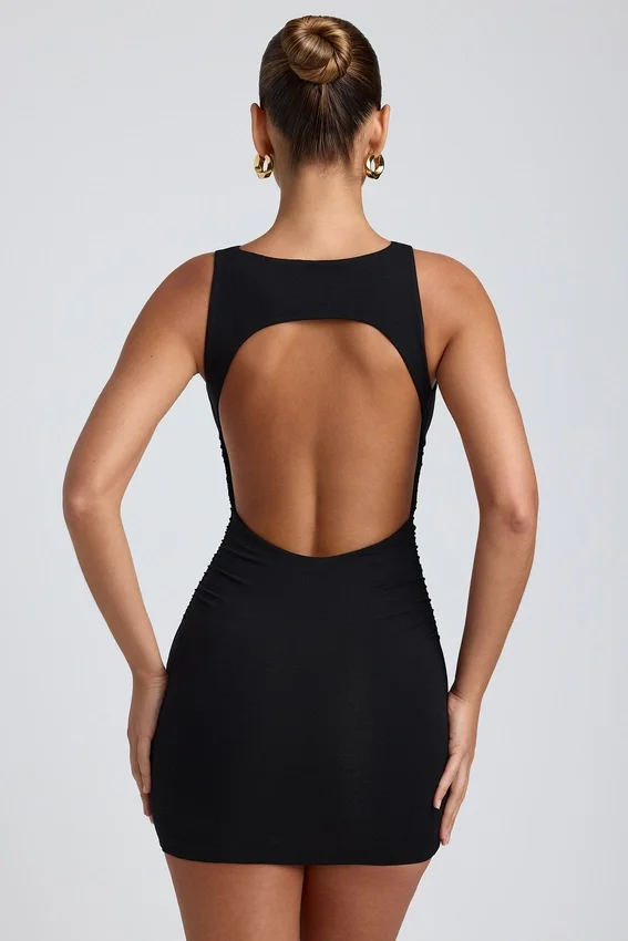 Vestido corto de modal, cuello alto y espalda abierta en negro Vestido corto de modal, cuello alto y espalda abierta en negro