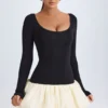 Vestido corto Delphi de modal con cuello redondo, cintura baja y bajo abullonado en color vainilla Vestido corto Delphi de modal con cuello redondo, cintura baja y bajo abullonado en color vainilla