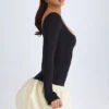 Vestido corto Delphi de modal con cuello redondo, cintura baja y bajo abullonado en color vainilla Vestido corto Delphi de modal con cuello redondo, cintura baja y bajo abullonado en color vainilla