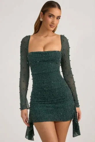Vestido corto drapeado con cuello vuelto y adornos Tivoli en verde esmeralda