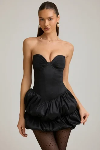 Vestido corto Laela de satén con bajo abullonado y corsé en negro