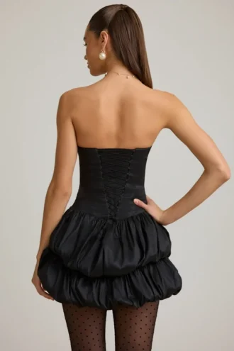 Vestido corto Laela de satén con bajo abullonado y corsé en negro