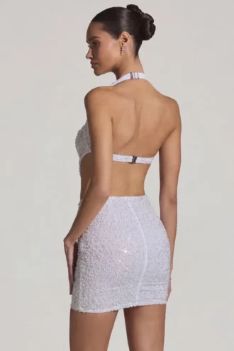 Vestido corto Lucia con escote halter y aberturas decoradas en blanco