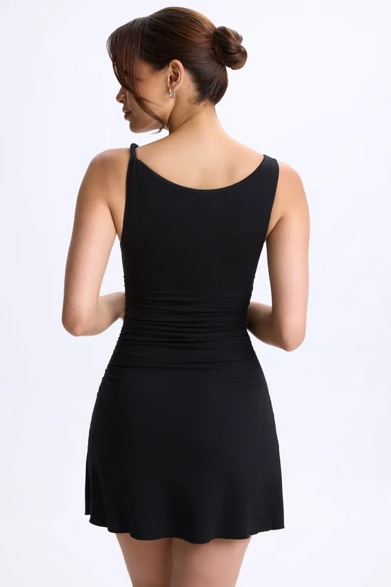 Vestido corto micro con fruncidos y corte en A de modal Ione en negro Vestido corto micro con fruncidos y corte en A de modal Ione en negro