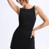 Vestido corto micro con fruncidos y corte en A de modal Ione en negro Vestido corto micro con fruncidos y corte en A de modal Ione en negro