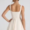 Vestido corto micro de corte A con detalle de lazo de Nanisca en color marfil
