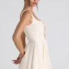 Vestido corto micro de corte A con detalle de lazo de Nanisca en color marfil