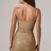 Vestido corto Neréa con fruncidos y detalles transparentes en dorado Vestido corto Neréa con fruncidos y detalles transparentes en dorado