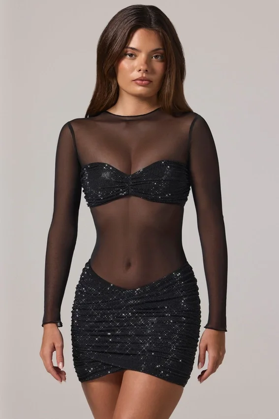 Vestido corto Noel de manga larga con cuello alto y adornos transparentes en negro Vestido corto Noel de manga larga con cuello alto y adornos transparentes en negro
