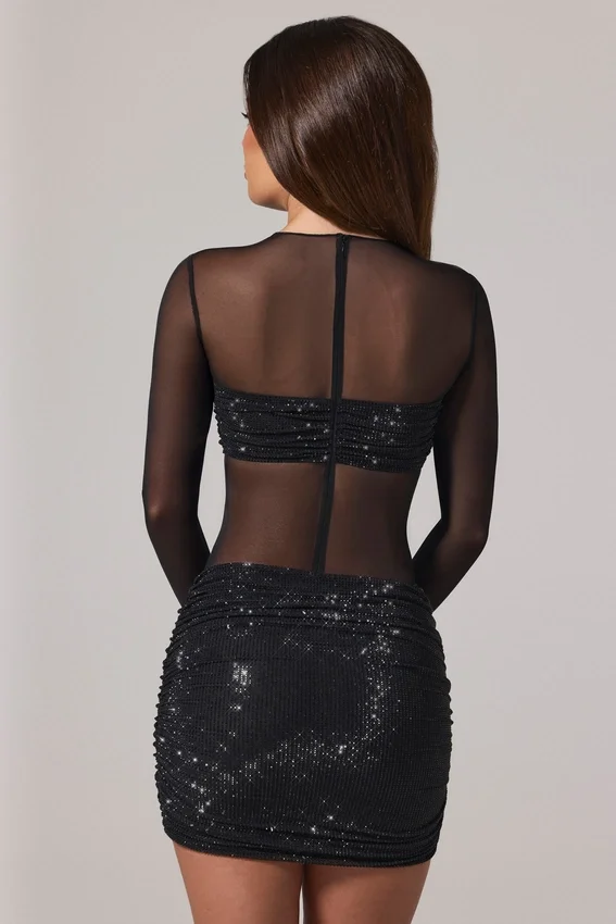 Vestido corto Noel de manga larga con cuello alto y adornos transparentes en negro Vestido corto Noel de manga larga con cuello alto y adornos transparentes en negro