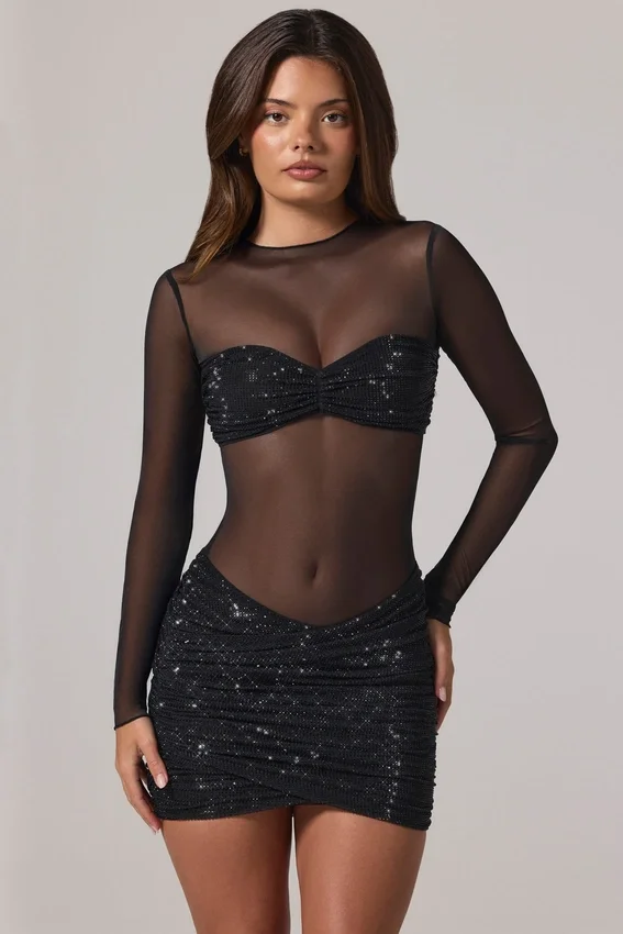 Vestido corto Noel de manga larga con cuello alto y adornos transparentes en negro Vestido corto Noel de manga larga con cuello alto y adornos transparentes en negro