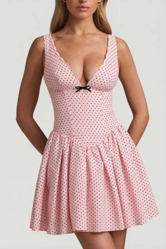 Vestido corto Sabina con detalle de lazo y corte en A en lunares rosa