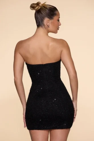 Vestido corto sin tirantes con cuello vuelto y adornos Basel en negro