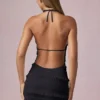 Vestido corto Tarryn con volantes, espalda descubierta y cuello halter en negro