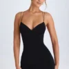 Vestido corto Tesni con cuello halter y tirantes en negro