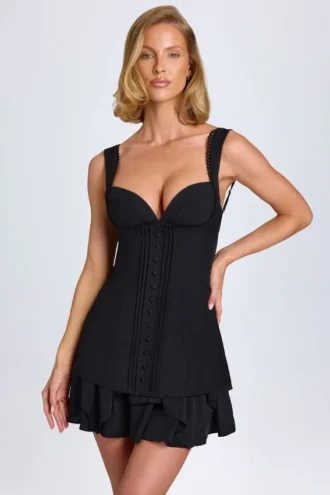 Vestido corto tipo corsé con volantes y botones Cassandra en negro