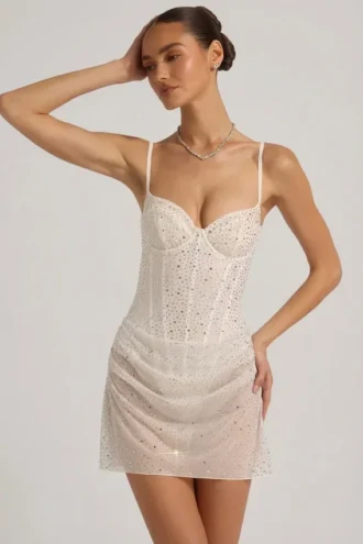 Vestido corto tipo corsé drapeado con adornos semitransparentes Connie en blanco