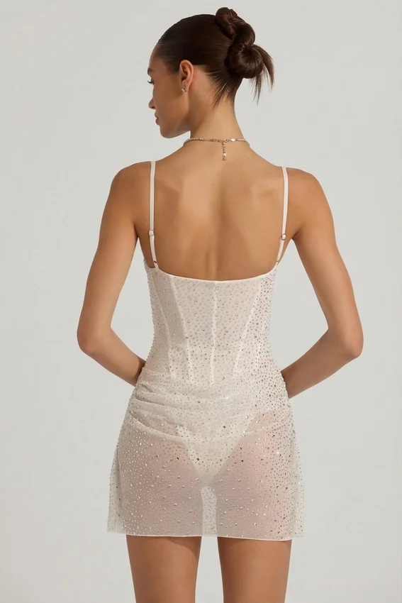 Vestido corto tipo corsé drapeado con adornos semitransparentes Connie en blanco
