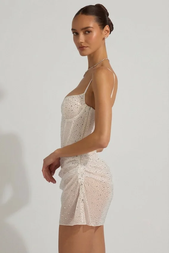 Vestido corto tipo corsé drapeado con adornos semitransparentes Connie en blanco