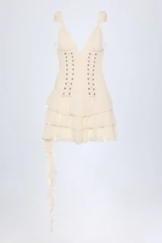 Vestido corto Toren con volantes y cordones en color marfil