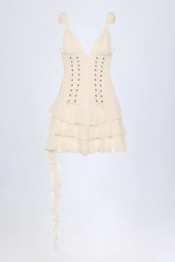 Vestido corto Toren con volantes y cordones en color marfil