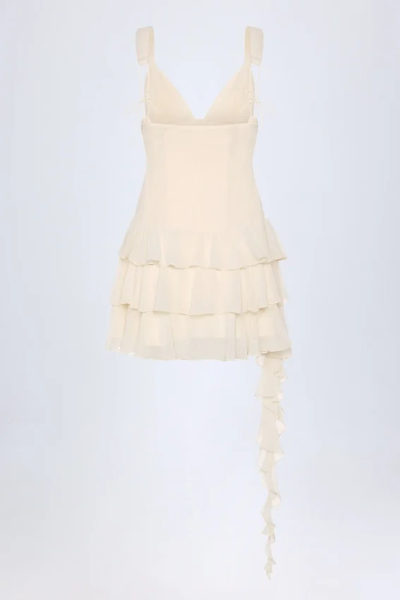Vestido corto Toren con volantes y cordones en color marfil