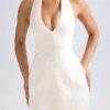 Vestido corto tulipán estructurado con cuello halter Harmonia en color marfil