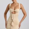 Vestido corto Zivanka de jersey elástico con aberturas y ribete de volantes en color crema