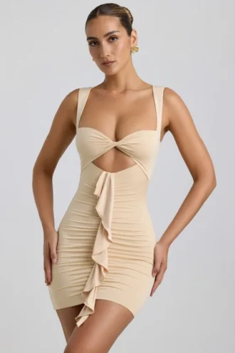 Vestido corto Zivanka de jersey elástico con aberturas y ribete de volantes en color crema