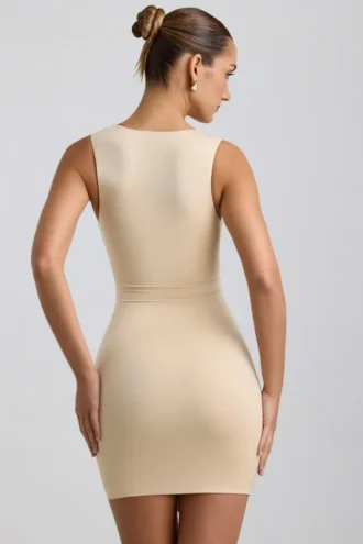 Vestido corto Zivanka de jersey elástico con aberturas y ribete de volantes en color crema