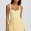 Vestido de tenis plisado con espalda abierta Soft Active en color limón
