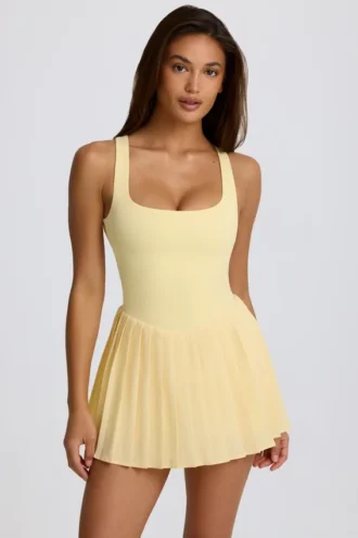 Vestido de tenis plisado con espalda abierta Soft Active en color limón