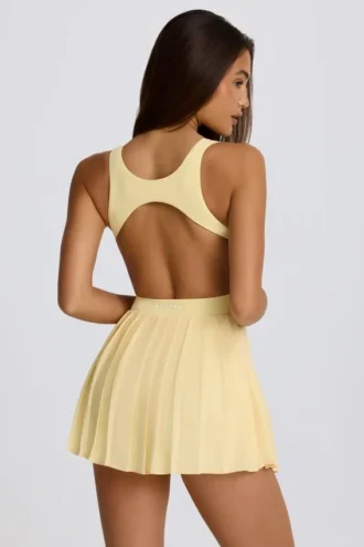 Vestido de tenis plisado con espalda abierta Soft Active en color limón