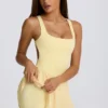 Vestido de tenis plisado con espalda abierta Soft Active en color limón