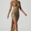 Vestido largo asimétrico con aberturas y adornos Persephone en dorado