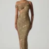 Vestido largo asimétrico con aberturas y adornos Persephone en dorado