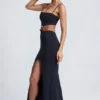 Vestido largo con aberturas y detalles metálicos Julitta en negro