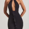 Vestido largo con cuello halter y volantes de Apolline en negro