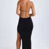Vestido largo con escote halter y aberturas Solaria en negro