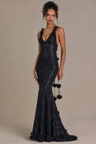 Vestido largo con escote pronunciado y espalda abierta adornado de Etoile en negro